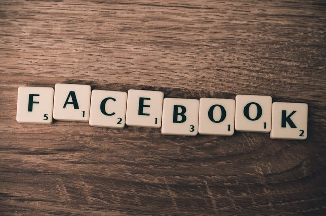 Scrabble tiles spelling out Facebook