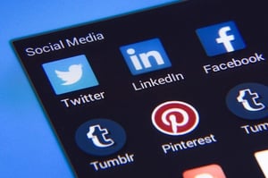 View of social media on a screen, includes Twitter, LinkedIn, Facebook, Tumblr and Pinterest icons